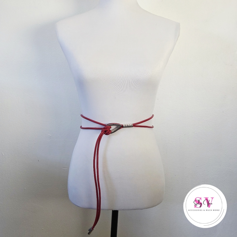 Red knotted belt with silver buckle